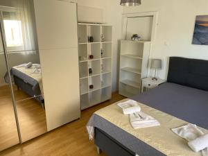 Ένα ή περισσότερα κρεβάτια σε δωμάτιο στο Villa Punta - Studios