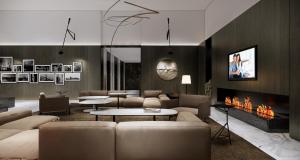 a living room with a couch and a fireplace at Somerset Xuhui Riverside Shanghai serviced apartments in Shanghai