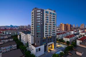 an overhead view of a tall building in a city at Somerset Xuhui Riverside Shanghai serviced apartments in Shanghai