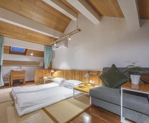 Postel nebo postele na pokoji v ubytování Hangzhou Shange Hotel