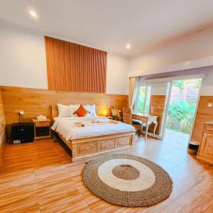 Postel nebo postele na pokoji v ubytování Agung Wiwin Homestay & Restaurant