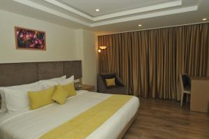 Postel nebo postele na pokoji v ubytování Royale Lalit Hotel Jaipur