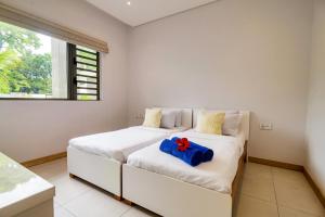 Letto o letti in una camera di Sea N Tree Beachfront Residences
