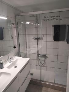 a bathroom with a shower and a sink and a mirror at San Nicolas by clabao in Pamplona