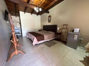 Ένα ή περισσότερα κρεβάτια σε δωμάτιο στο El Portal de La Quebrada