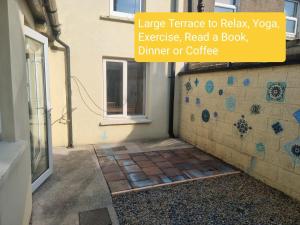 a bathroom with a tiled floor and a window at Portobello City Centre Dublin 8 Sleep 5 in Dublin