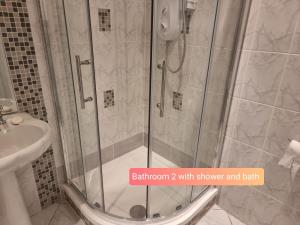 a shower with a glass door in a bathroom at Portobello City Centre Dublin 8 Sleep 5 in Dublin +12 photos