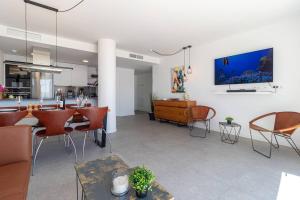 a living room with a dining room and a kitchen at Seaview 3-bed Flat With 2 Terraces Mijas Pueblo in Mijas