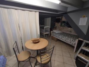 a room with a table and chairs and a bed at Maison sur le causse du Quercy Lot 46 in Cremps