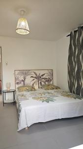 Una cama o camas en una habitación de Le cocouning