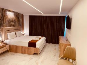 Postel nebo postele na pokoji v ubytování Rosa Therapy Butik Otel