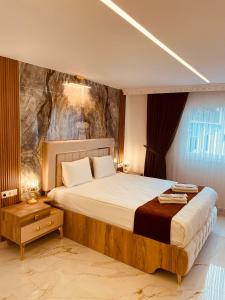 Postel nebo postele na pokoji v ubytování Rosa Therapy Butik Otel