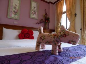 Letto o letti in una camera di Flower Bird House B&B