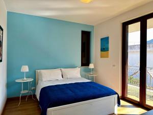 Postel nebo postele na pokoji v ubytování Garden House Alla Torre