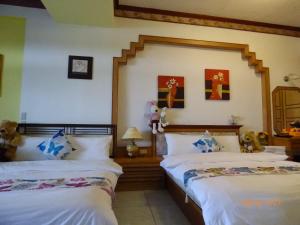 Letto o letti in una camera di Flower Bird House B&B