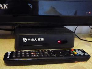 TV o dispositivi per l'intrattenimento presso Flower Bird House B&B