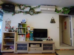 TV o dispositivi per l'intrattenimento presso Flower Bird House B&B