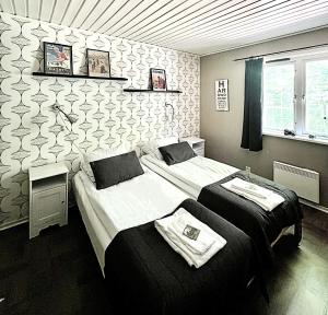Postel nebo postele na pokoji v ubytování STF Korrö Gårdshotell - B&B
