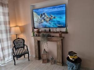 TV o dispositivi per l'intrattenimento presso Casa vacanze VesuviusView