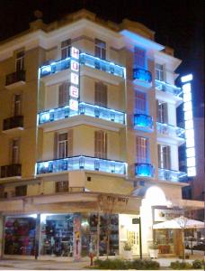 a large building with blue lights on top of it at Metropolis Hotel in Serres