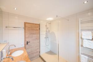 a bathroom with a shower and a sink at Hotel Goldener Engel in Ihringen