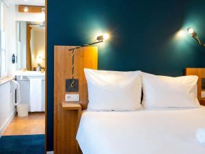 Postel nebo postele na pokoji v ubytování ibis Styles Nancy Centre Gare