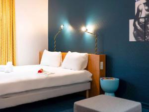 Postel nebo postele na pokoji v ubytování ibis Styles Nancy Centre Gare