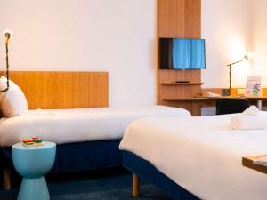 Postel nebo postele na pokoji v ubytování ibis Styles Nancy Centre Gare + 37 fotografií
