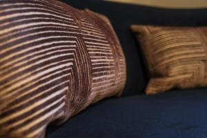 a close up of two pillows on a bed at The Willow - Studio 28 in Bristol