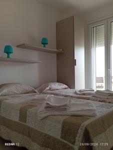 Postel nebo postele na pokoji v ubytování Casa mare Torre Pali Salento
