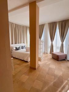 Postel nebo postele na pokoji v ubytování Regina Margherita B&B