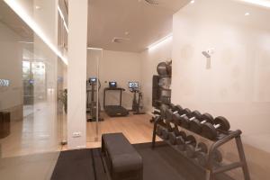 a gym with a row of chairs in a room at NAU Sao Rafael Suites - All Inclusive in Albufeira