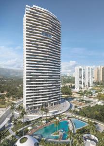 a tall building with a pool in front of it at Benidorm Beach apartment - Costa Blanca in Benidorm