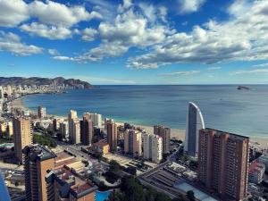 an aerial view of a city and the ocean at Benidorm Beach apartment - Costa Blanca in Benidorm