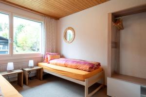 Postel nebo postele na pokoji v ubytování Apartment Bischofberger D22