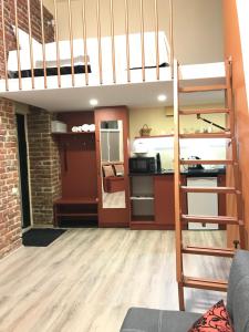 a living room with a bunk bed and a kitchen at Center Lviv Avenue 23 in Lviv