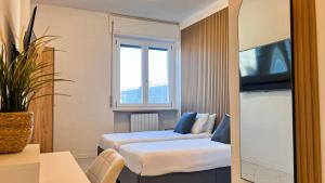 Μια τηλεόραση ή/και κέντρο ψυχαγωγίας στο Dream & Relax Apartment
