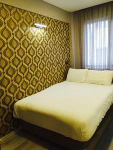 Postel nebo postele na pokoji v ubytování Okur Otel