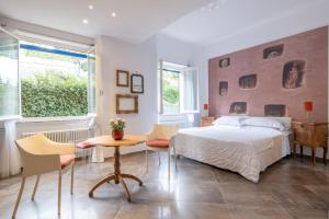 Rúm í herbergi á Albergo Minerva