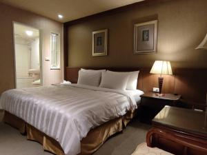 Postel nebo postele na pokoji v ubytování Dahshin Hotel + 37 fotografií