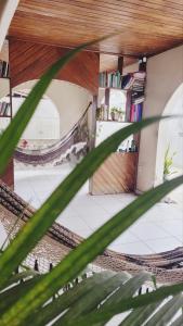 a view of a building from a plant at Casa Luxo Ampla Completa COP30 in Ananindeua