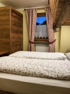 Letto o letti in una camera di Flora Alpina apartments - Residenza Bieltschocke