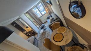 an overhead view of a living room with a table at L'Oursina in Chamonix
