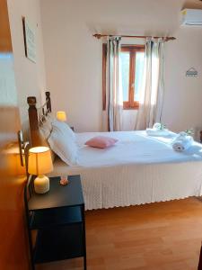 Postel nebo postele na pokoji v ubytování Elia House