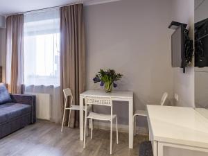 TV a/nebo společenská místnost v ubytování PARK HOTEL VILNIUS