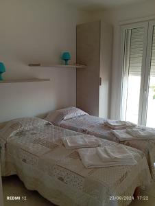 Voodi või voodid majutusasutuse Casa mare Torre Pali Salento toas
