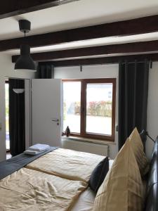 Postel nebo postele na pokoji v ubytování Freistehendes Ferienhaus Mit Garten