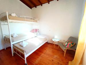 Postel nebo postele na pokoji v ubytování Elia House