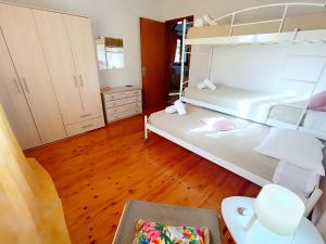 Postel nebo postele na pokoji v ubytování Elia House