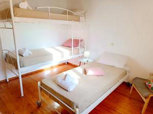 Postel nebo postele na pokoji v ubytování Elia House